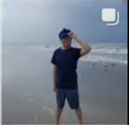 Luni at the beach with visor.
