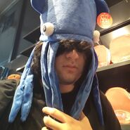 Brian wearing a blue squid hat