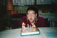 Chris tearfully celebrating their 21st birthday, the day they was kicked out of English class.