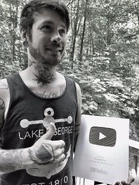 Mike with the 100,000 subscribers award