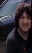 A young James in the background of the "Beer Man Asks for a Light" video that was originally uploaded in 2008[21]