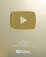 Golden Play Button (with Angry Prash's name).