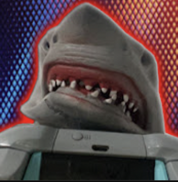 Shark puppet singing top