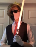 Ranboo holding a lightsaber on his shoulder