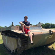 MrBeast sitting on a tank.