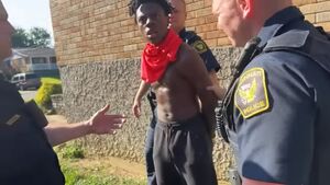 Darren being detained by police officers from the Cincinatti Police Department.