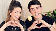 Zoe and Alfie making heart shapes with their hands