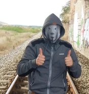 Appearance (with his face covered)