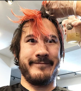 Mark getting his hair cut and dyed black on the said date.