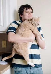 Emile holding his cat Teddy