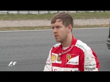 Sebastian_Vettel_lends_a_hand_after_spinning_in_Barcelona_testing