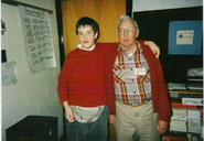 Chris with their father Bob in spring 1996 at Providence Middle School class, the time they graduated from it.