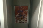 Flor hangs a "Revenge of the Cock" poster