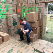 MrBeast in his box fort, which he built in his "I Built A Mansion Using Only Cardboard Boxes" video.