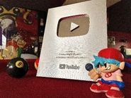 FNF100KPlayButton.jpg (4.09 MB) The channel's Silver Play Button.