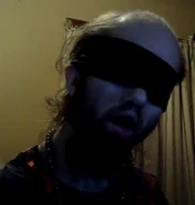 Cyraxx blindfolded.