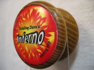 Special "mod" yo-yo made by Eric Wolff. A yo-yo made of osage orange wood with the side caps of an Inferno