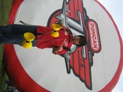 Ian posing with the Duncan 75th Anniversary giant Yo-Yo balloon in Singapore