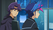 Yusaku and Shoichi Kusanagi working on a trap to catch the AI program.