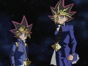 Yami Yugi and Yugi looking at their friends as they have defeated Pegasus and rescued everyone he captured.