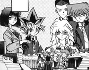 The players look at their characters after the game.