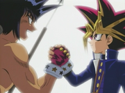 Yami Yugi shakes hand with Mako as friends after the latter's defeat.