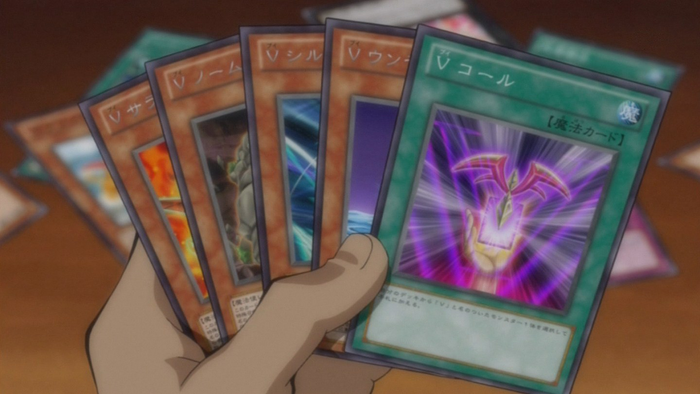 Yuma. holding several "V" cards. 