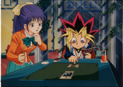 YGO-Movie-1999-Yugi-teaches-Miho-how-to-play-DM