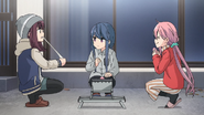 Surprise Camping and Some Deep Thoughts (Season 2, Episode 3), Rin grills yakimochi, placing Sho's Grill on the Captain Stag Low Folding Table