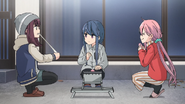 Rin cooks yakimochi using Sho's Grill