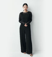 Full-body image in dark clothing