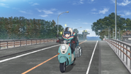 Rin crosses Nagisahashi Bridge, used in Nadeshiko's flashbacks