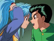 Yusuke hits Botan over the head.