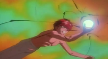 Yusuke sosteniendo la esfera de poder espiritual