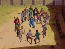Yusuke in Kuwabara's body, getting into a fight with local thugs.