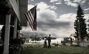 Garnett and Warren look out at the thunderstorm approaching.