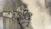 The town as seen from a satellite with the large dust storm being the Zombie Horde.