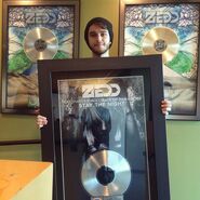 Zedd with a framed Stay the Night cover