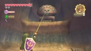Link enganchando una zarpa en un objetivo, en Skyward Sword.