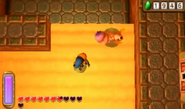 Debirando indefenso fuera de la arena en A Link Between Worlds