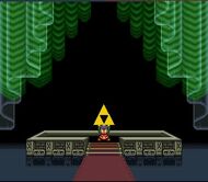 Link met la main sur la Triforce.