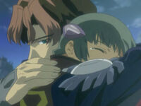 Luke and Blake embrace after the Seismosaurus is defeated.