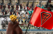  standing before an assortment of Neo-Zenebas Zoids, displaying the Empire's insignia.
