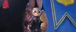 Bellwether trying to be seen in the picture with Lionheart and Judy Hopps