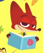 Nick reading a book with a pawpsicle on its cover